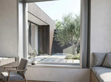 Modern interior with a large window view of a garden.